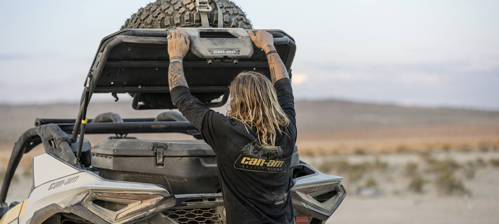 Can-Am ambassador Terry Madden lifting the trunk of his Maverick R SxS to access the LinQ cargo box