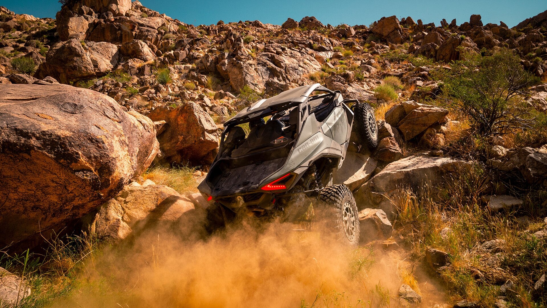 A Can-Am Maverick R X rc climbing rocks 