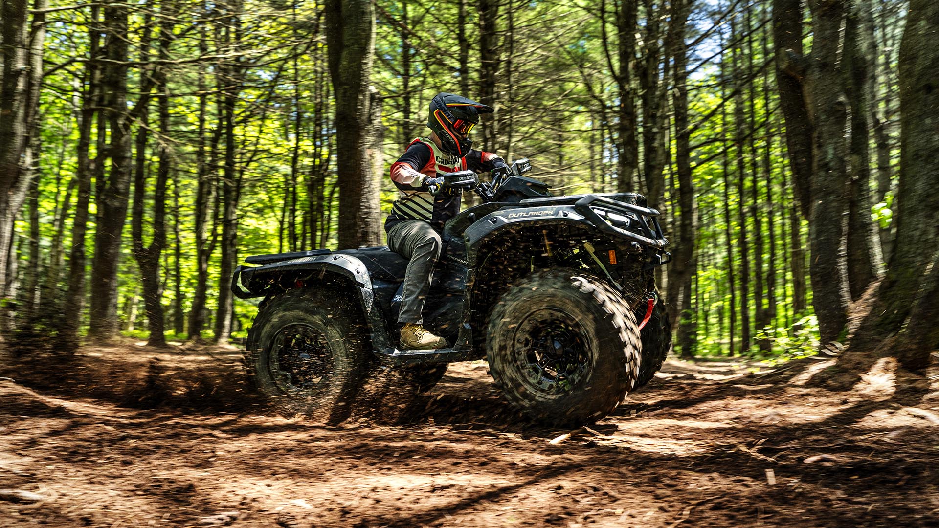 2026 Can-Am Outlander 1000R Multicam Dark Camo in the forest