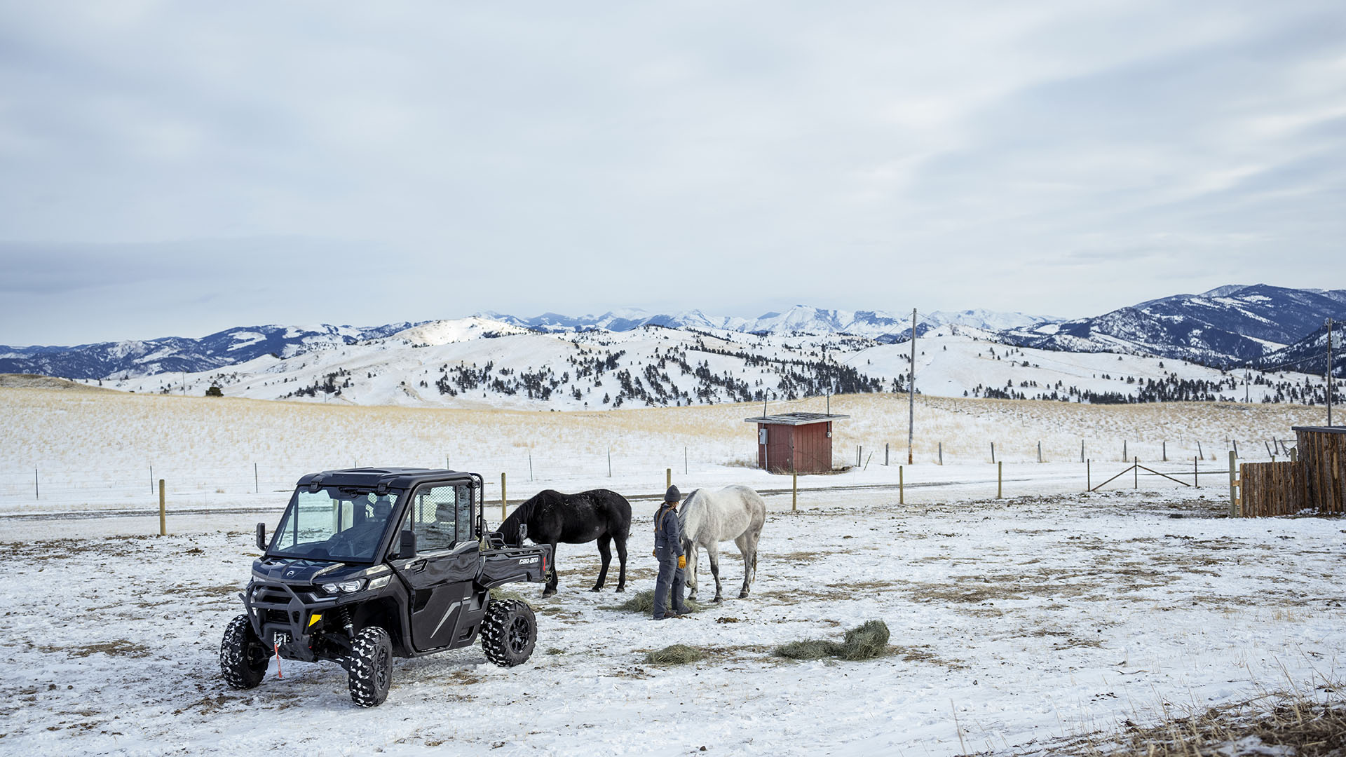 Defender XT SxS on a snowy farm field