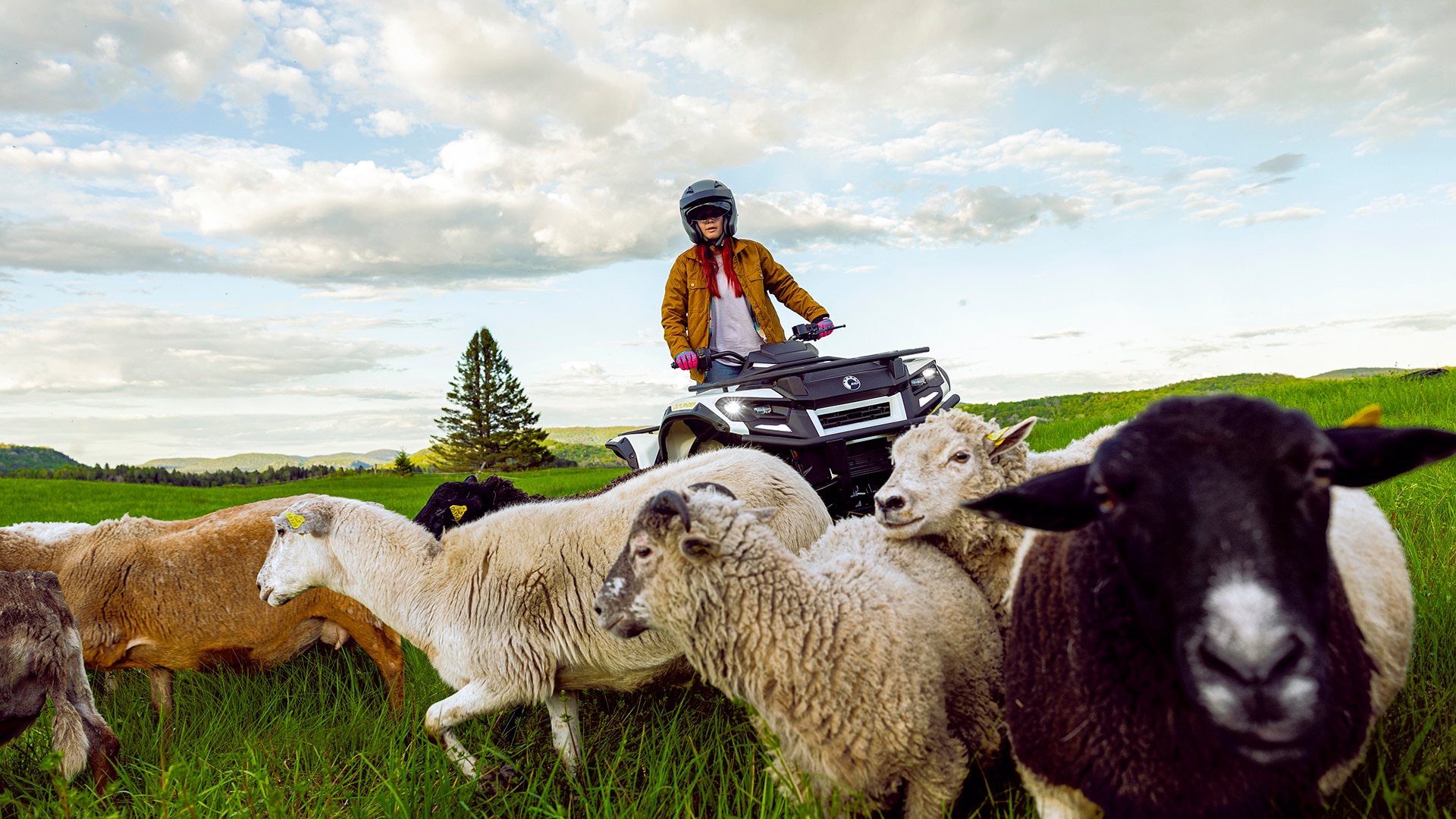 A 2026 Can-Am Outlander Electric on a farm