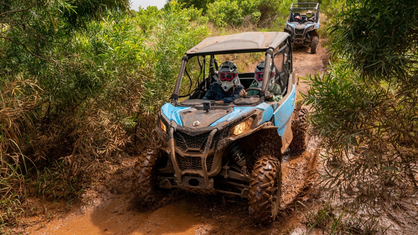 2 Can-Am Maverick Sport's on muddy trail