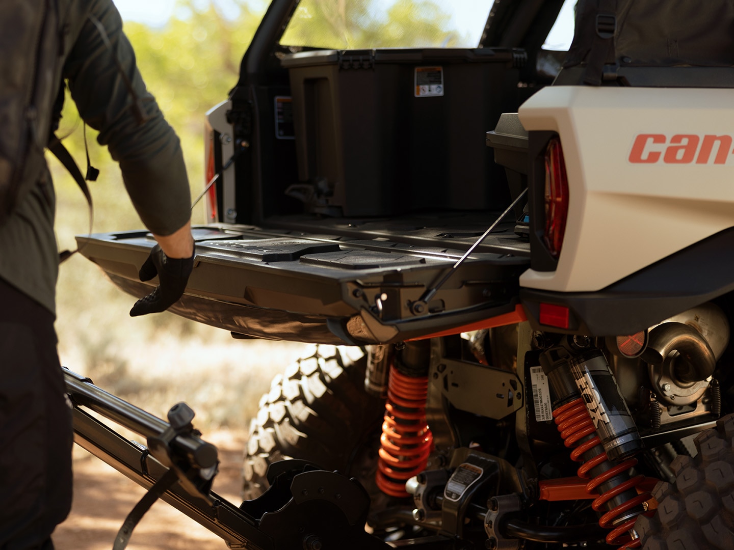 How to adjust SxS shocks on my Can-Am vehicle?